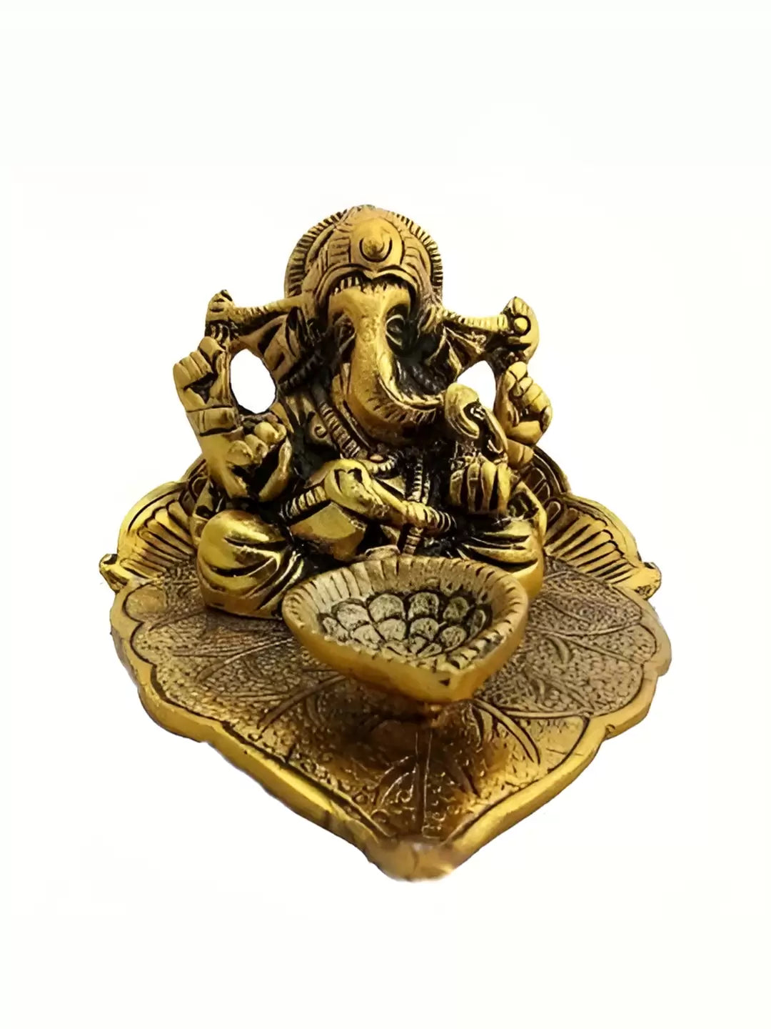 Ganesha Idol Sitting on leaf with diya